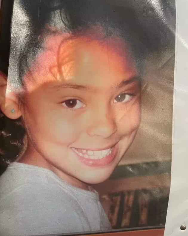 Close up photo of a girl smiling.