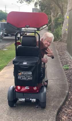 A woman on a mobility scooter