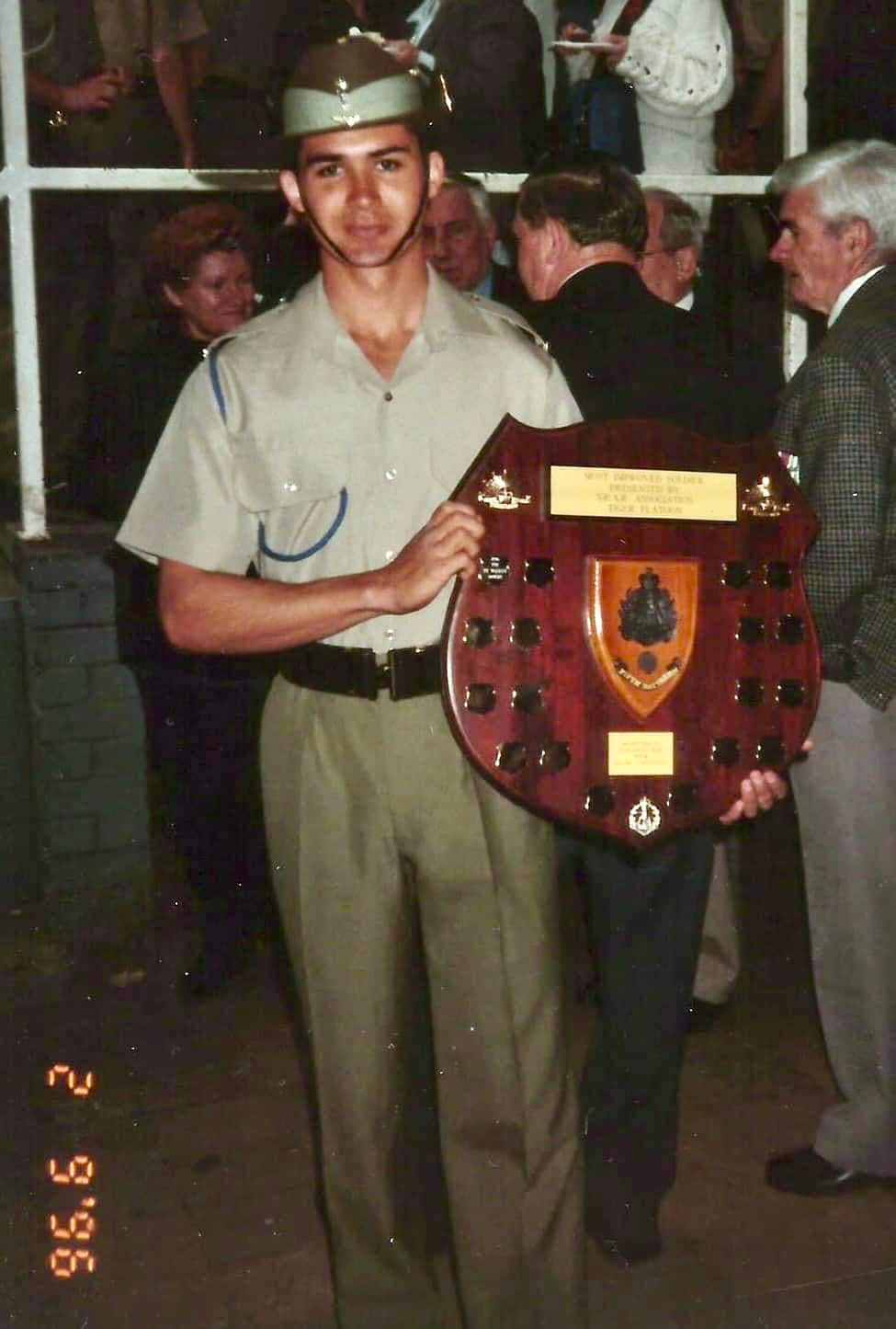 Paul walker in australian army uniform displaying a trophy