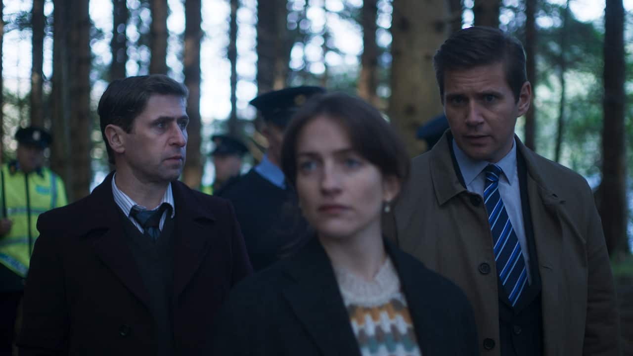 3 detectives walk through the woods