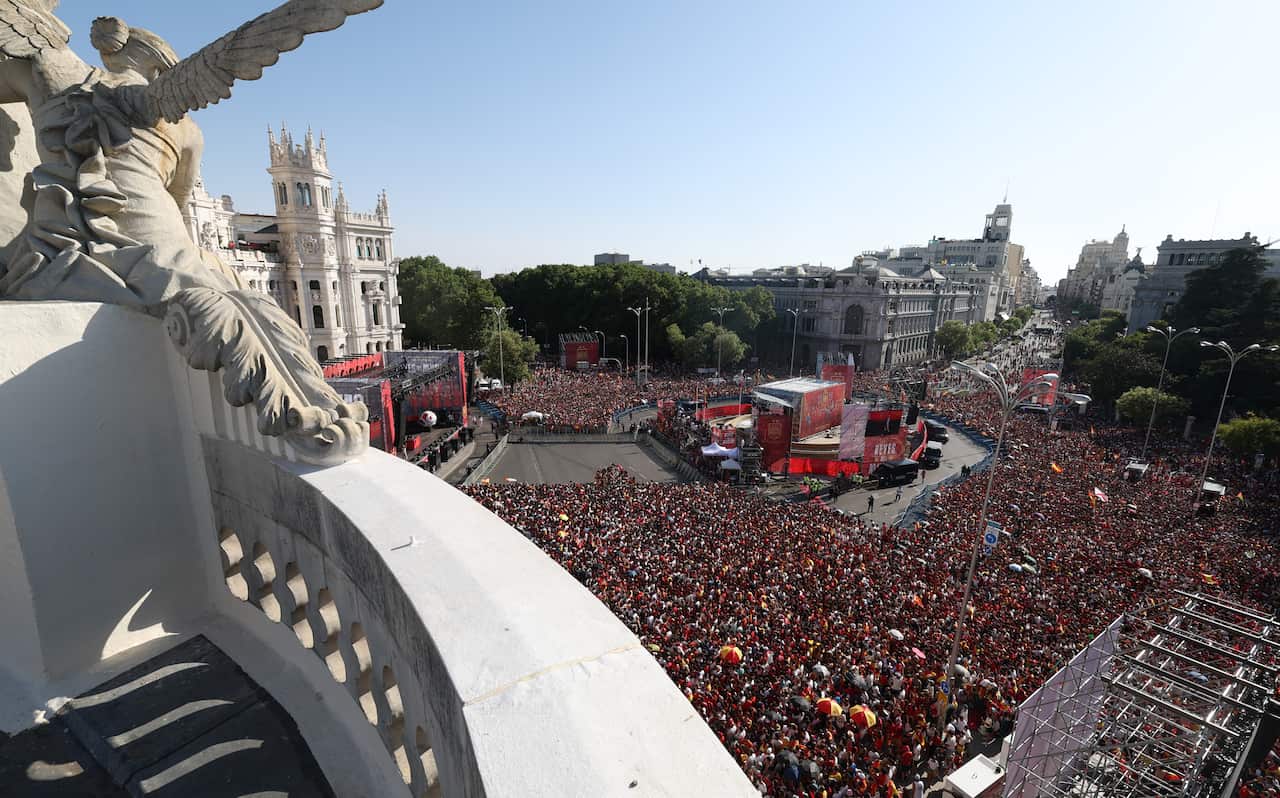 A top view of thousands of people at a city square
