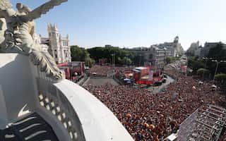 A top view of thousands of people at a city square