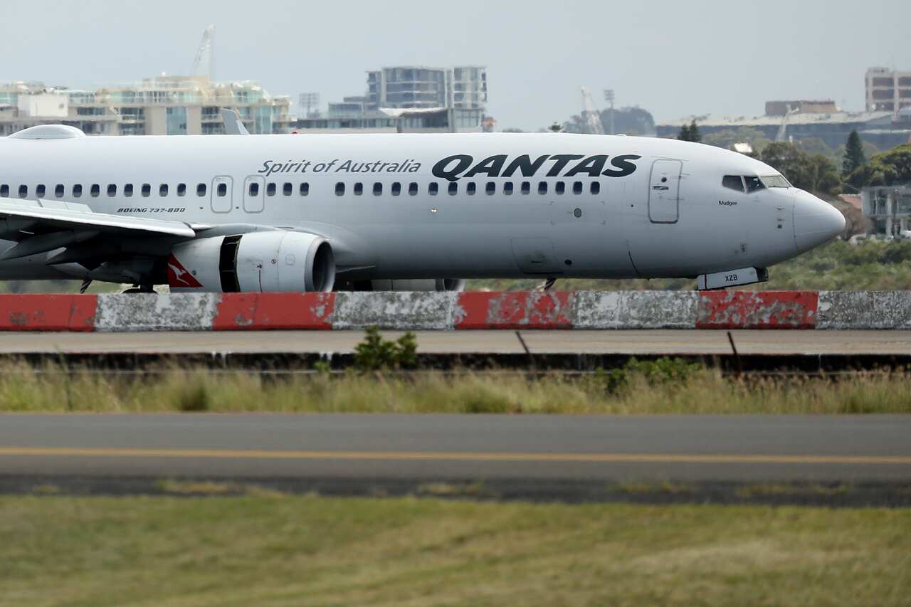 A plane on the tarmac. Part of a panel for an engine cover is missing.