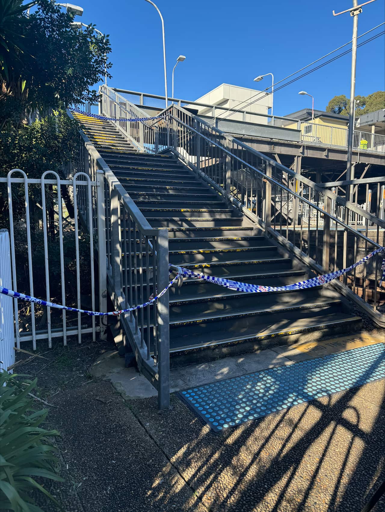 Police tape cordon off steps 
