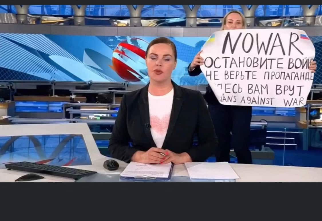 Russian Channel One editor Marina Ovsyannikova is seen holding a poster reading "Stop the war. Don't believe the propaganda. Here they are lying to you", during a live news bulletin.