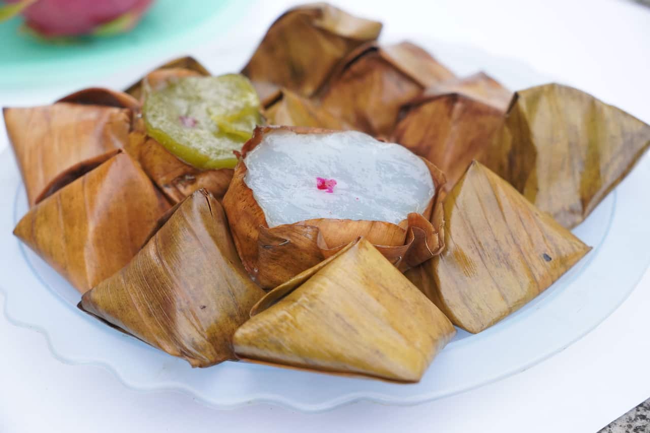 Stuffed Dough Pyramid Dessert, Stuffed Dough Pyramid, year cake, Chinese New Year’s cake, dessert Made with glutinous rice flour and sugar put banana leave small basket and steamed cooked
