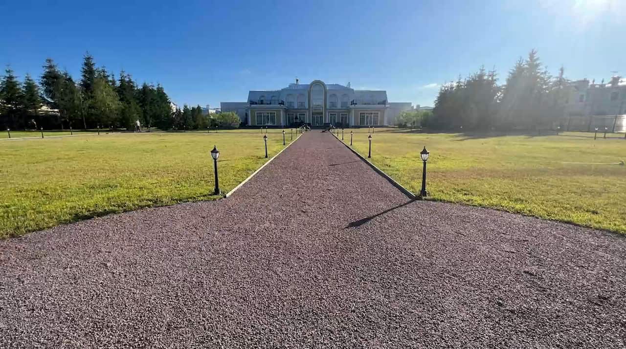 The exterior of a palatial-looking house.