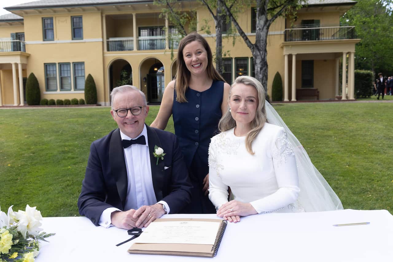 Anthony Albanese and Jodie Haydon signing their marriage certificate