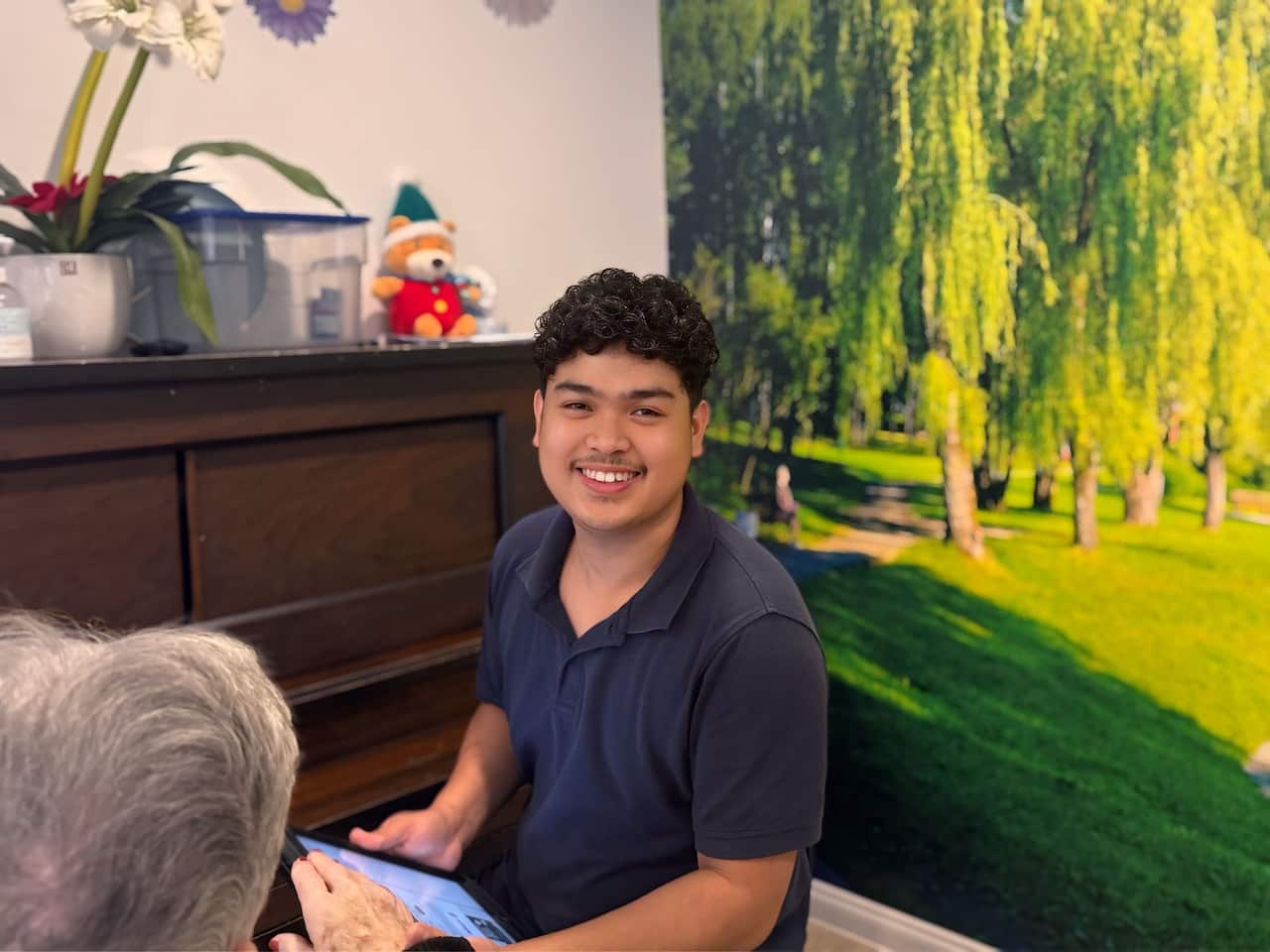 Alvin Encarnacion working in an aged care facility in Melbourne.jpg