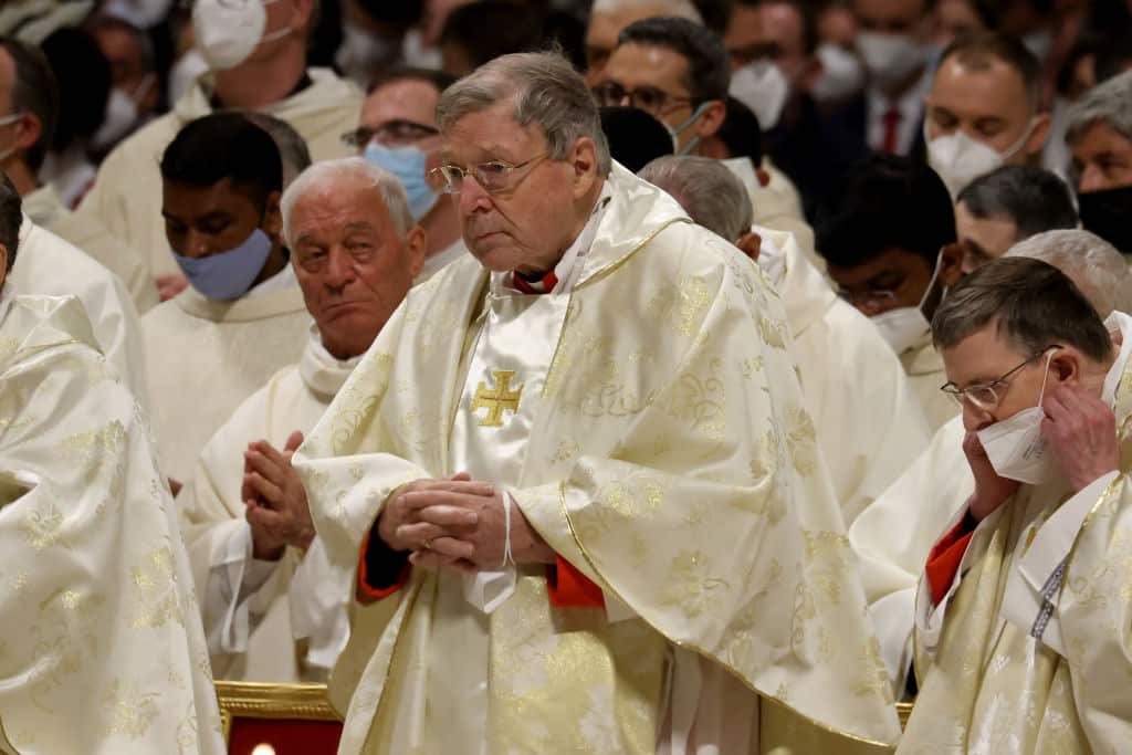 George Pell wearing white robes at a church service