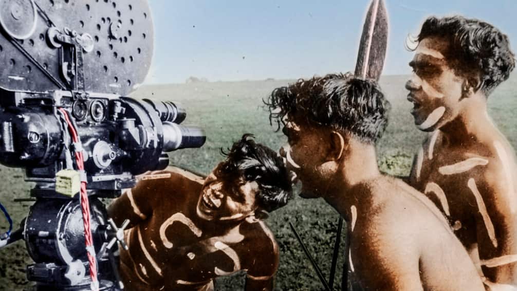 Three boys around First Nations filmmaker Bill Onus' camera, as seen in 'Ablaze'.