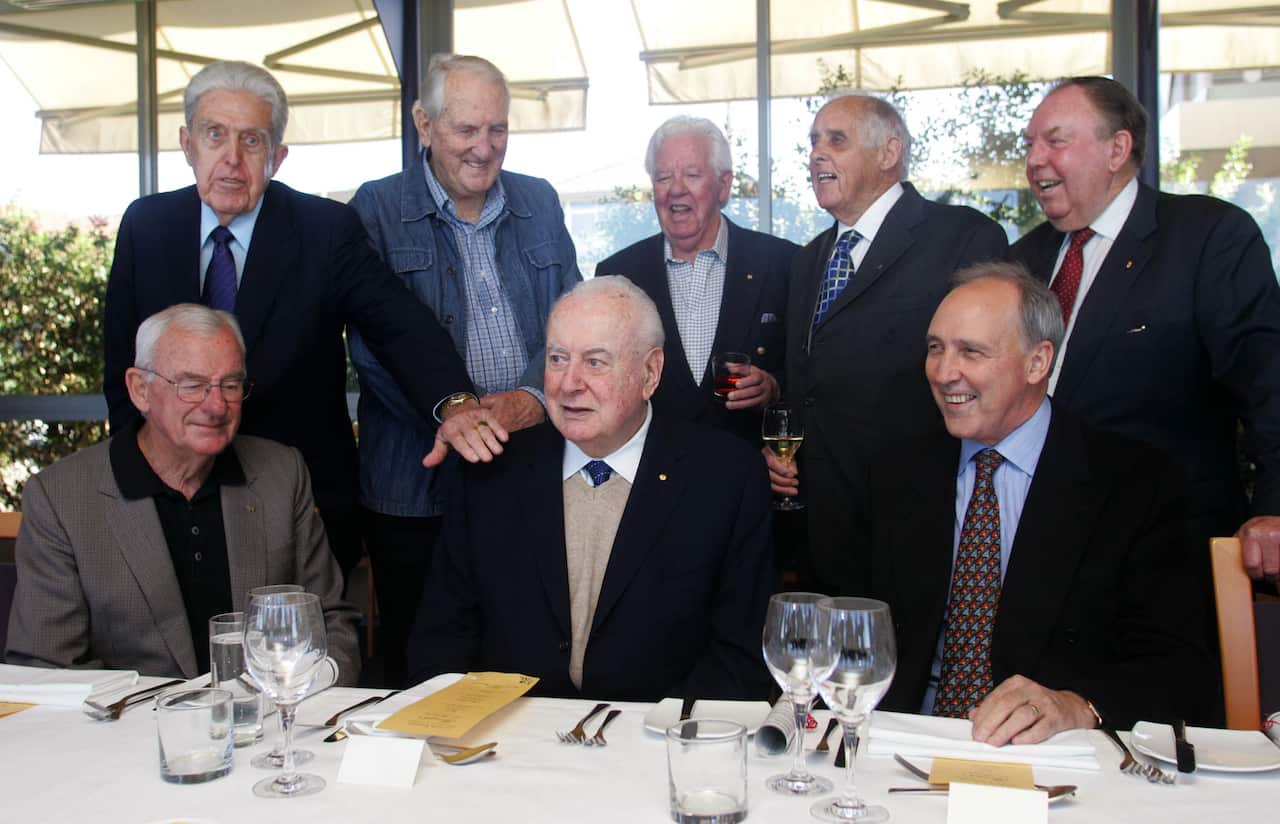 Former Labor leader Gough Whitlam (centre) poses for a photo with former members of his cabinet (L to R:) Bill Hayden (front left), Kep Enderby, Tom Uren, Joe Riorde, Les Johnson, Doug McClelland, Paul Keating (front right).