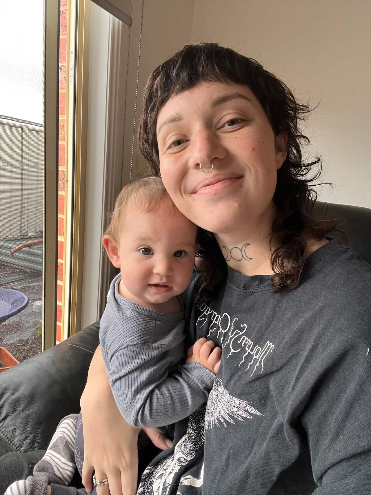 A woman holds a baby