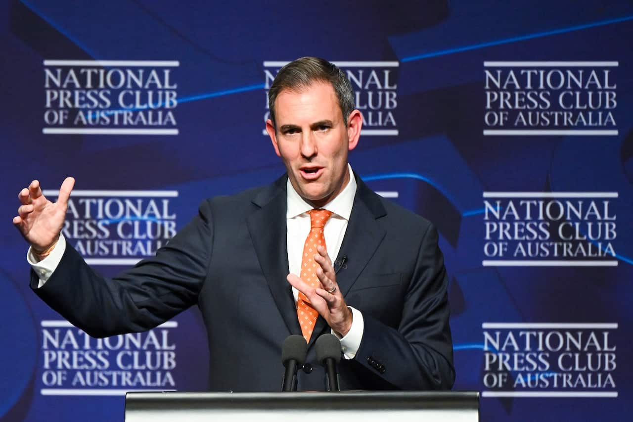 Man in suit and orange tie.