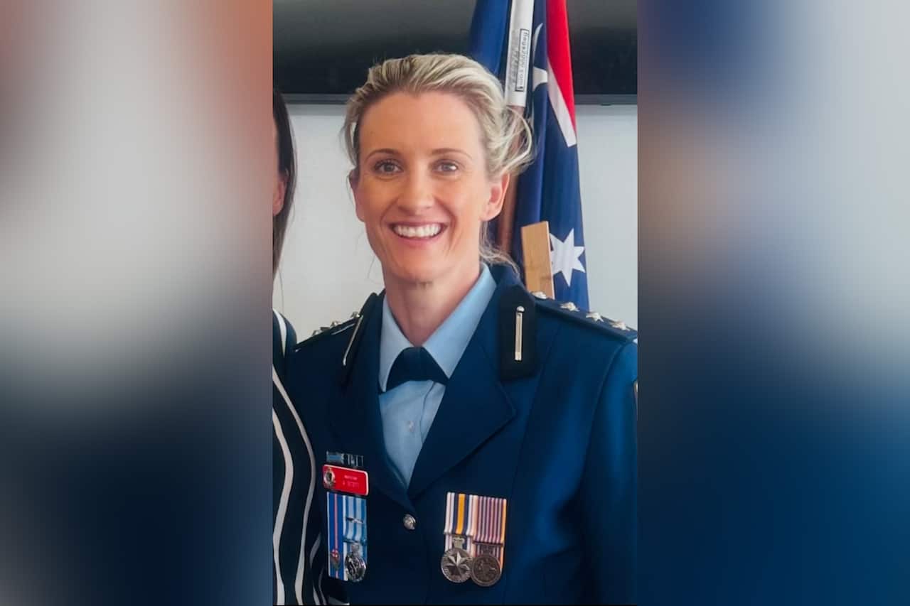 A portrait shot of a female police officer.
