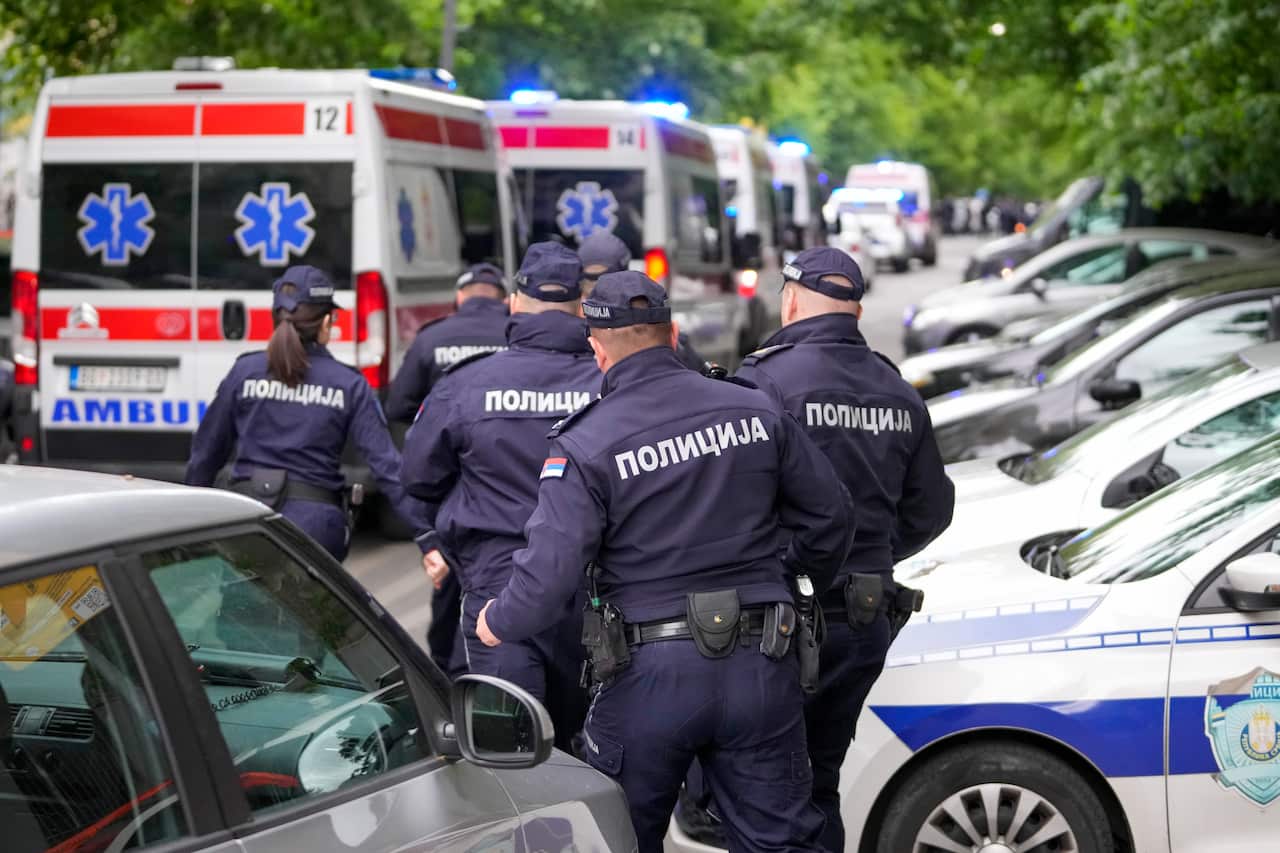 Police officers block the streets surrounding the Vladislav Ribnikar school in Belgrade