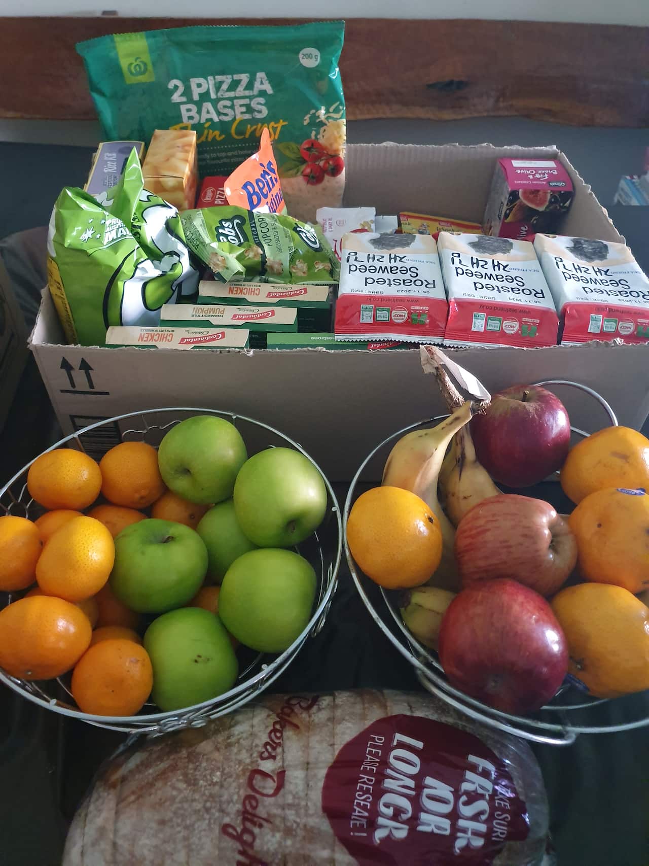 Boxes containing basic food and groceries. 