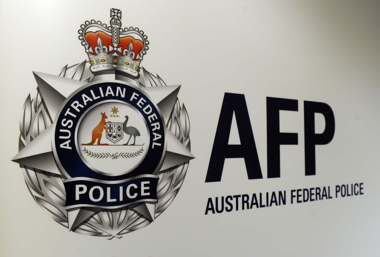 An Australian Federal Police logo.