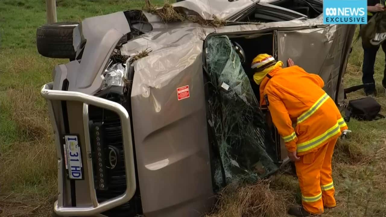 destroyed flipped vehicle on its side