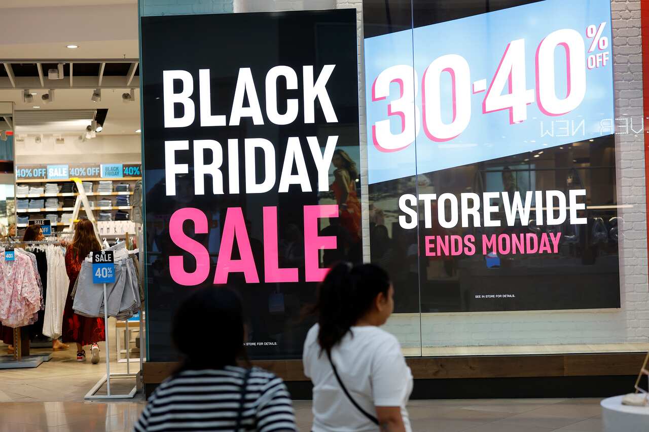 A sign out the front of a store that says "Black Friday Sale" in big letters.