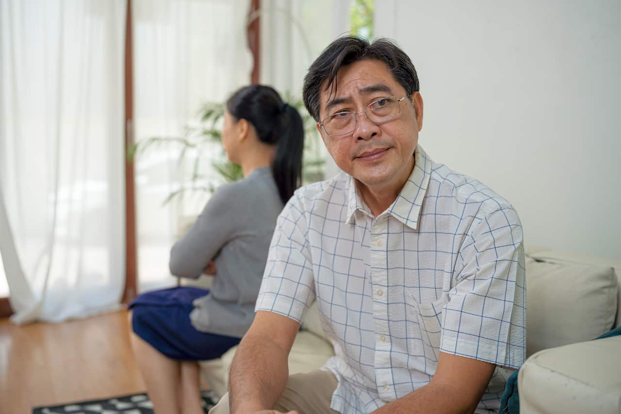 Upset senior man has argument with wife.