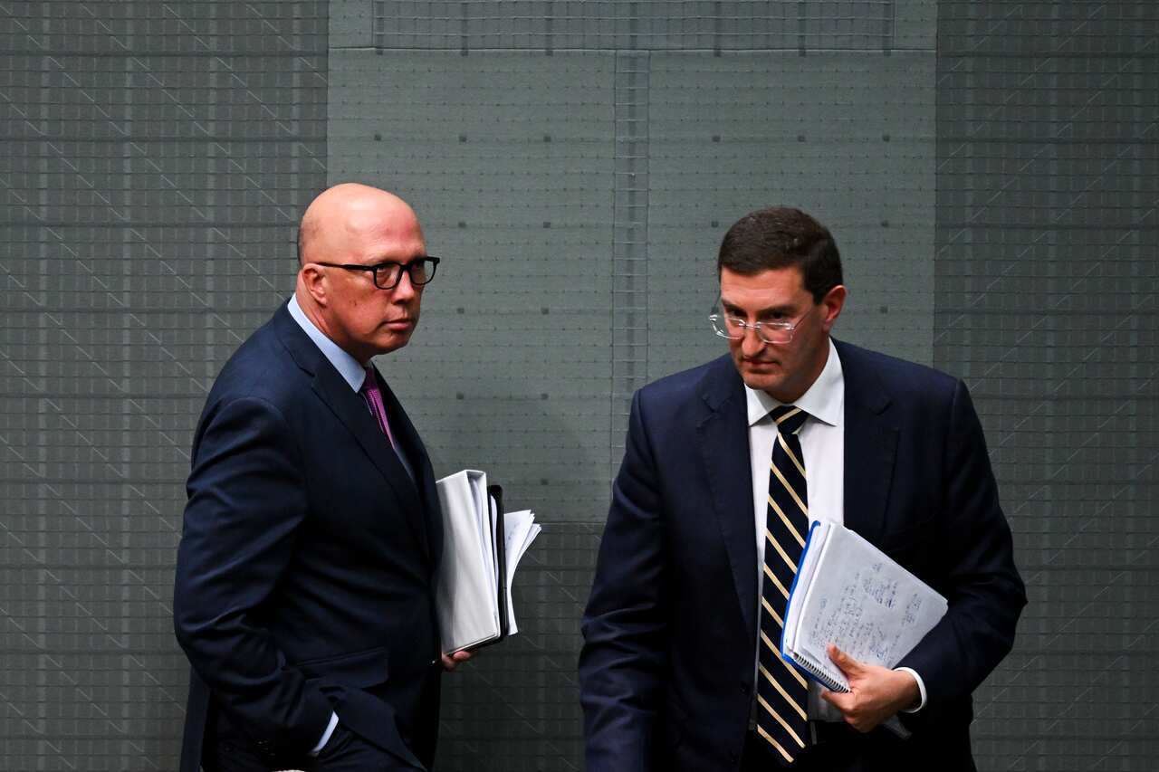 Two men wearing suits