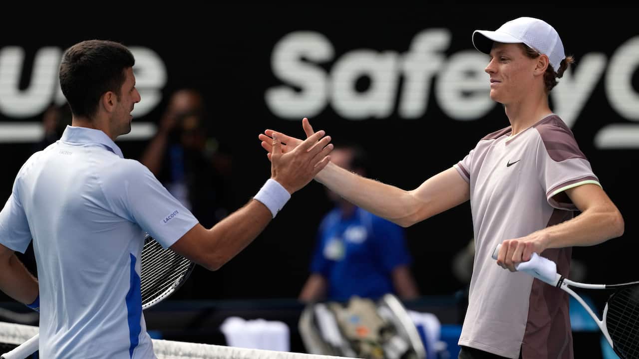 Jannik Sinner of Italy is congratulated by Novak Djokovic of Serbia following their semifinal at the Australian Open tennis championships at Melbourne Park