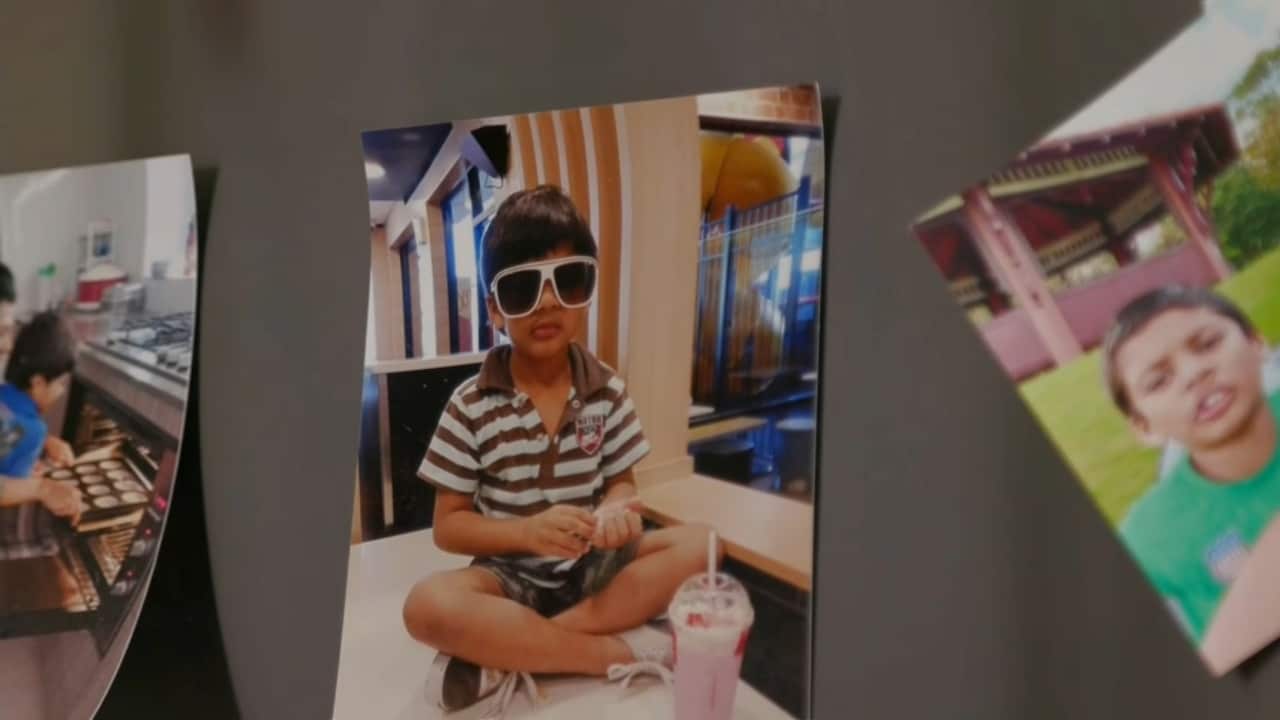 Photos of a child on a fridge