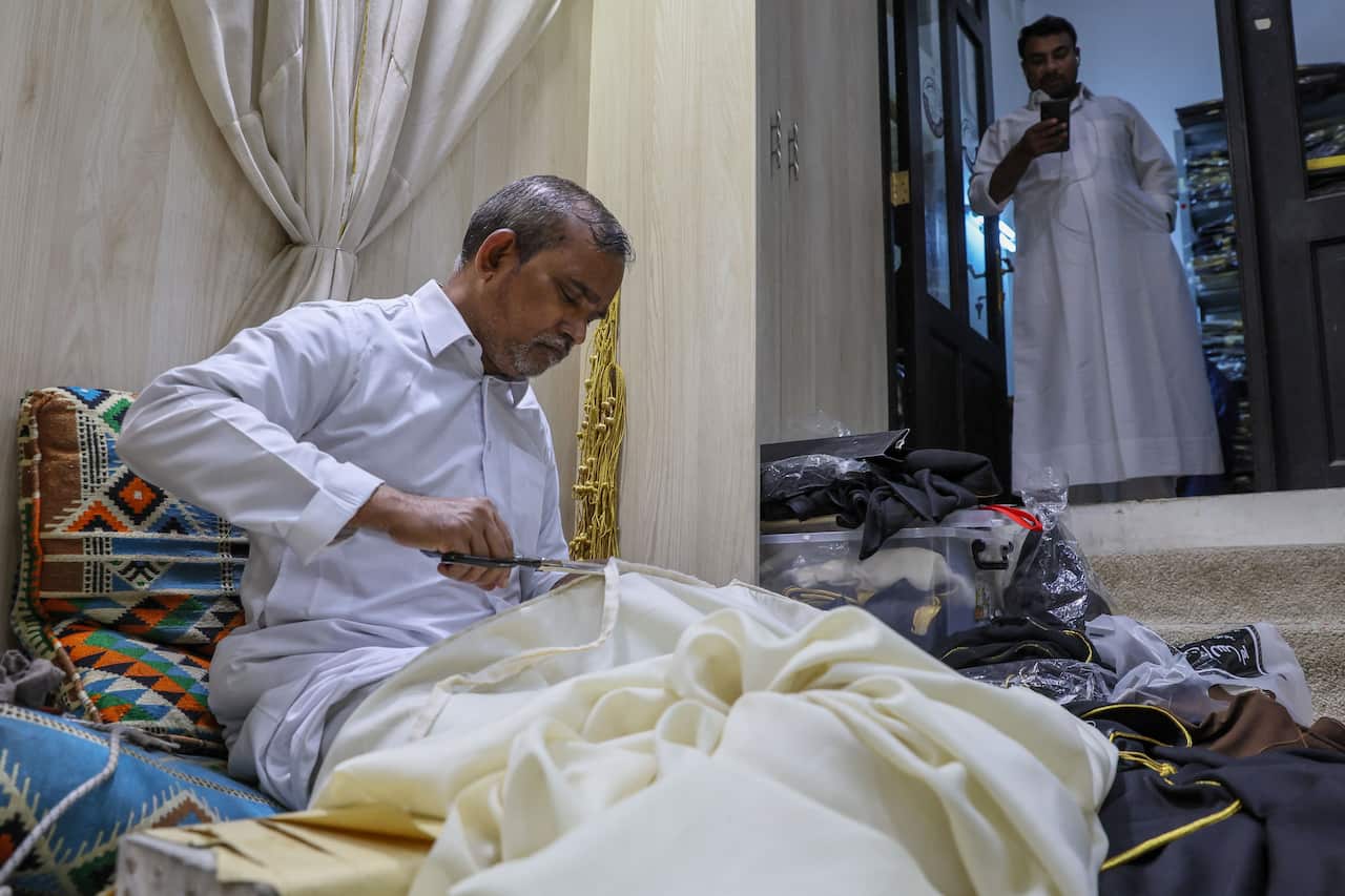 A man cutting fabric.
