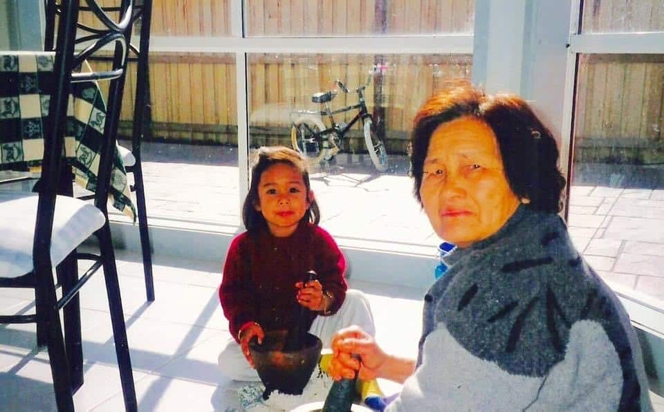 Nat with grandma cooking.jpg