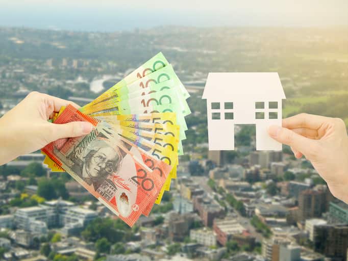 Client giving Australian money to property agent for buying house