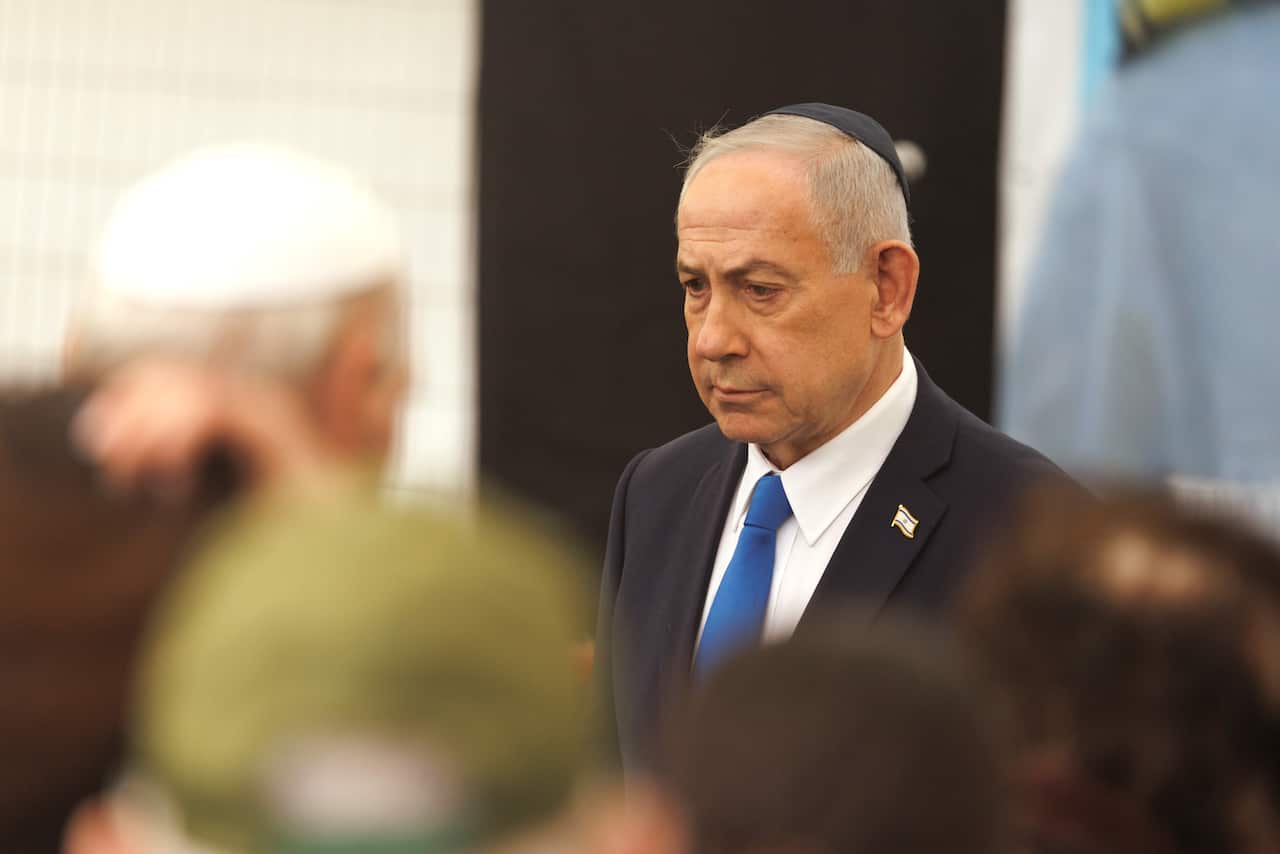Benjamin Netanyahu wearing a traditional Jewish skullcap 