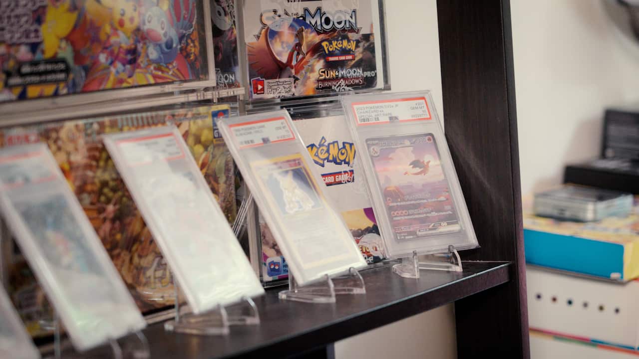 A display shelf of collectable cards in plastic coverings