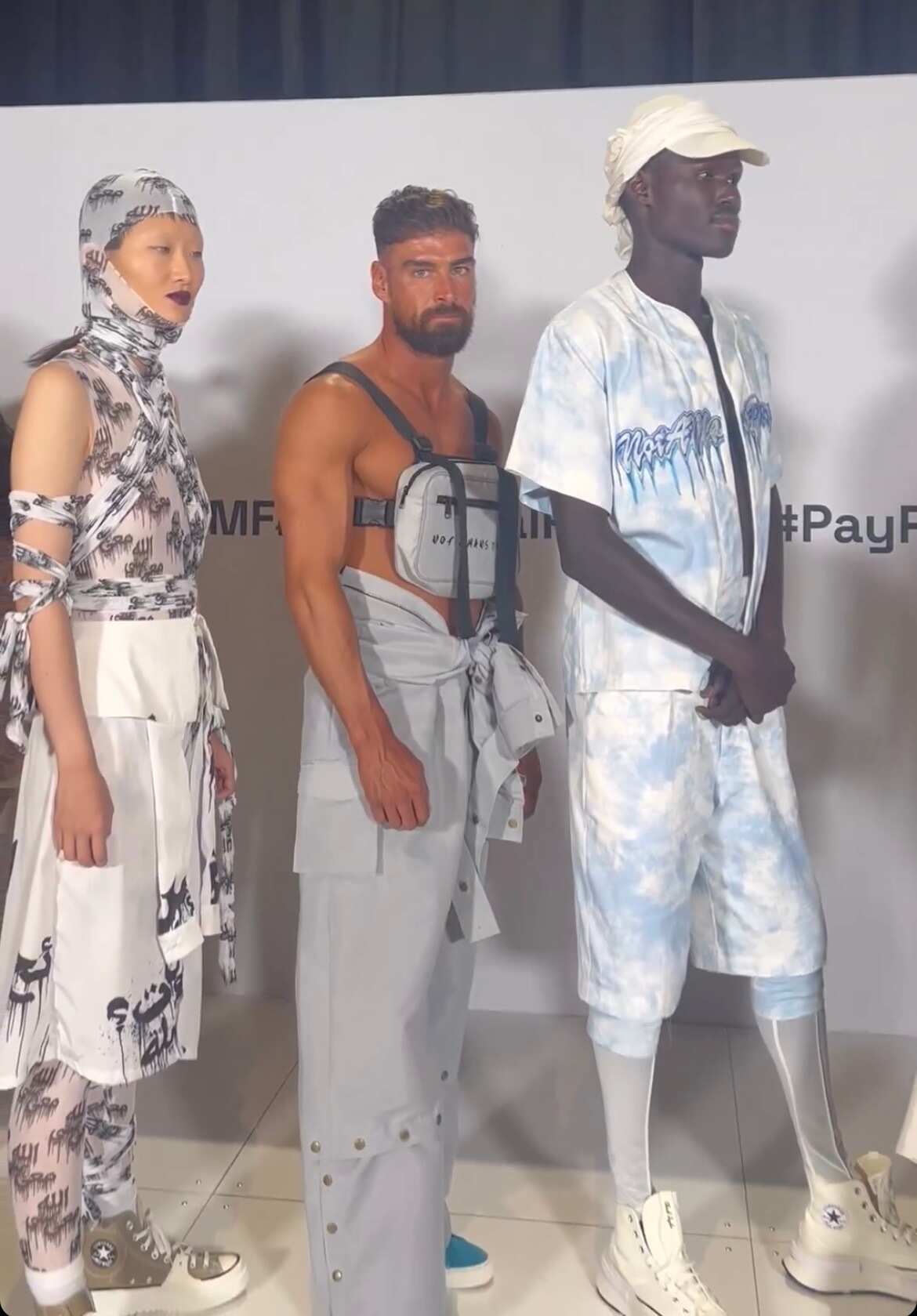 Models lining up behind the scenes. 