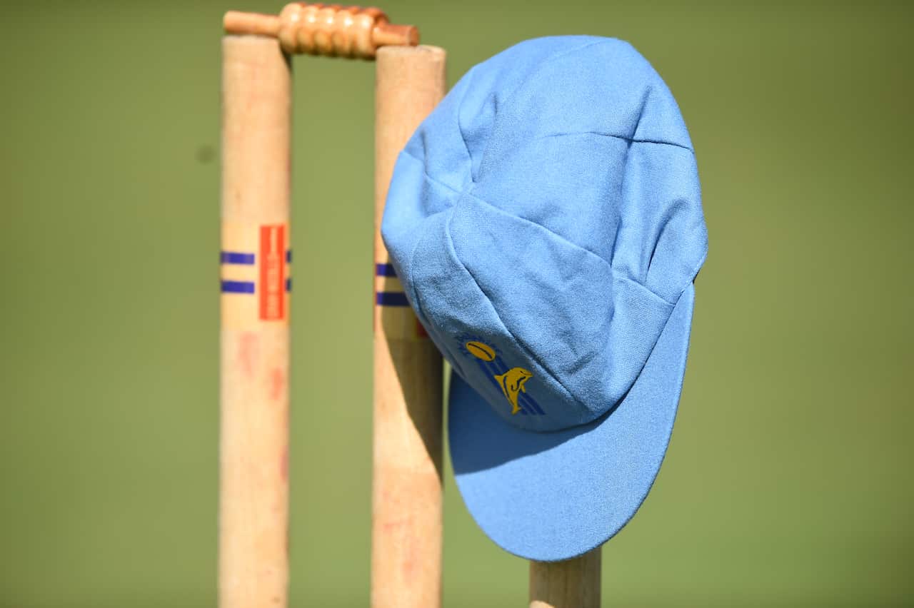 Stumps with Andrew Symonds' Gold Coast Dolphins cap are pictured during the private memorial service in Townsville. 