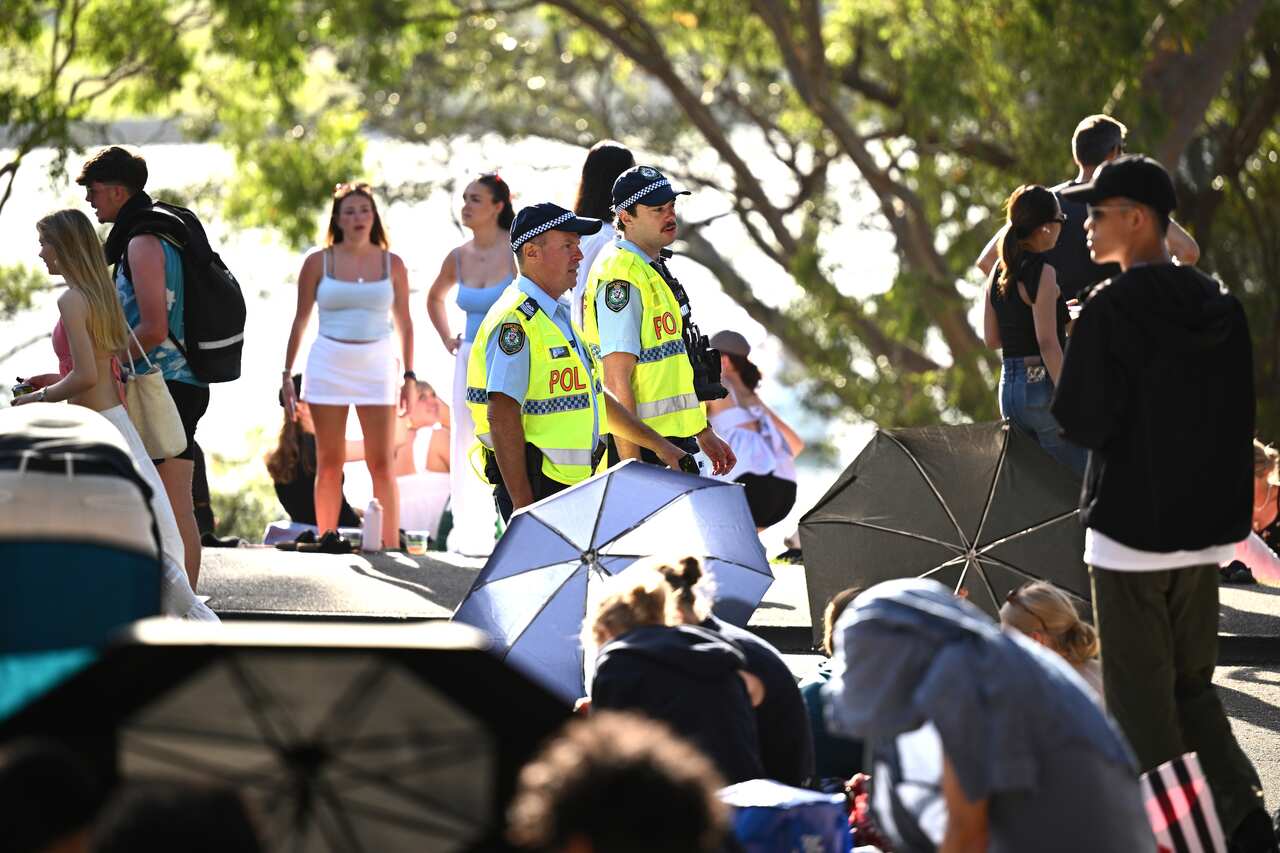 Two police officers among a crowd