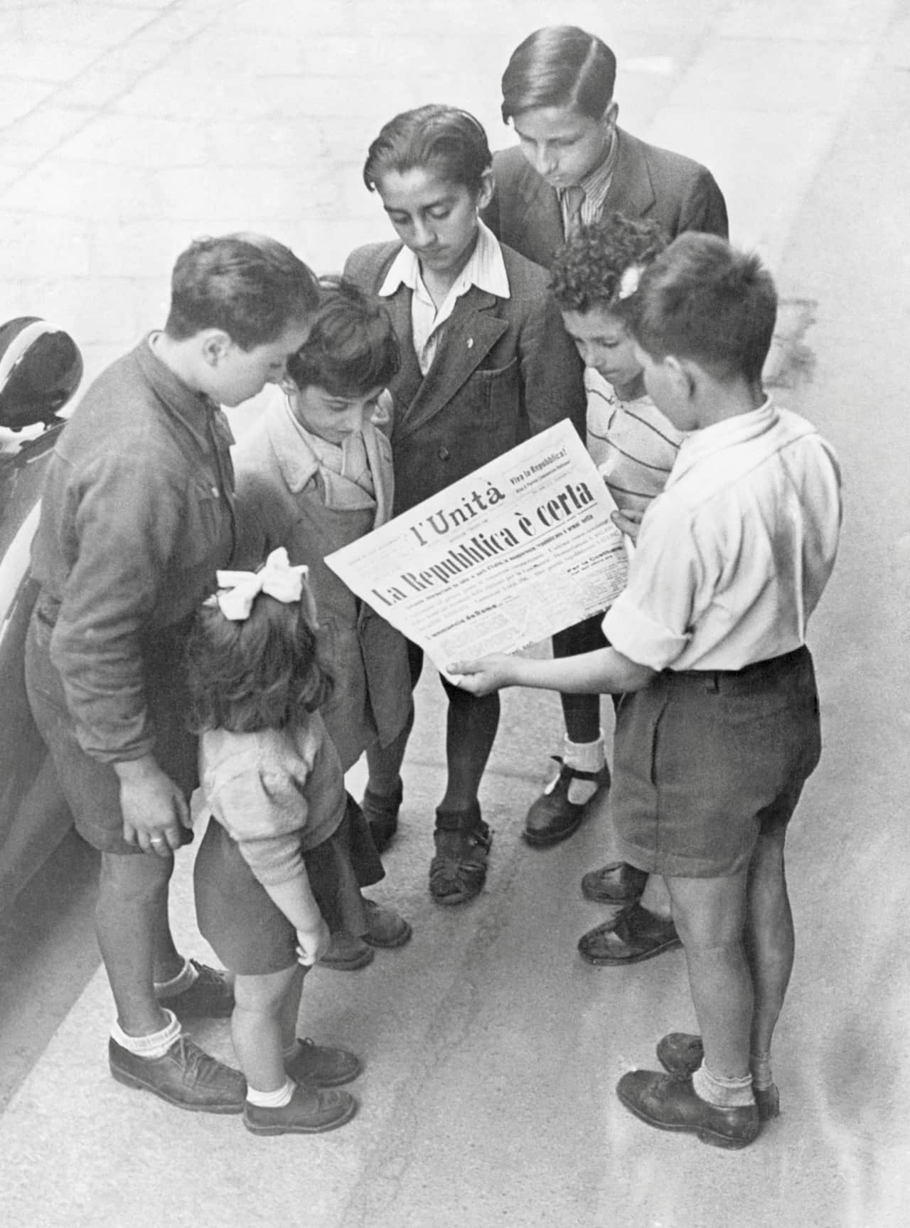 Boys Reading Newspaper
