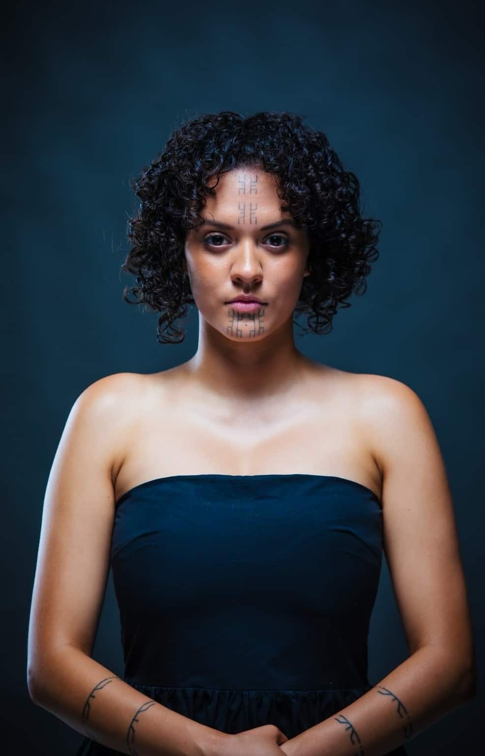 A woman stands for a portrait.