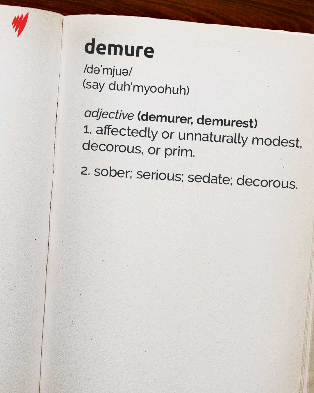 A digital illustration showing the word "demure" and its definition on the page of a dictionary.