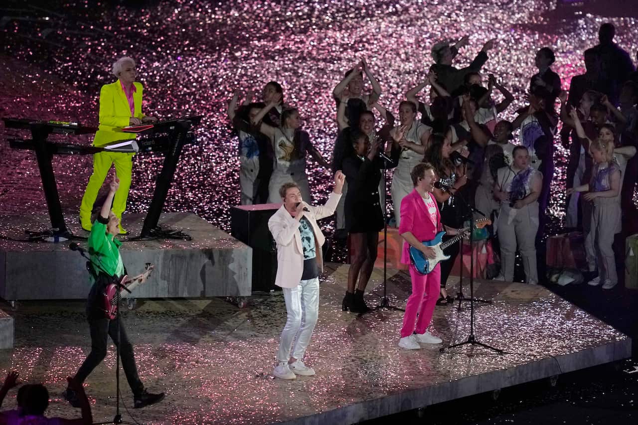 Duran Duran are performing on stage in front of confetti 