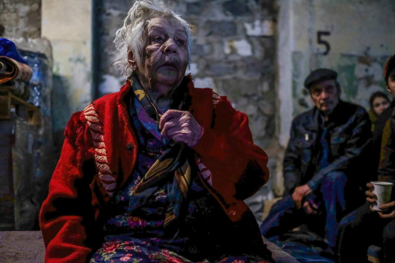 An injured woman seen inside a centre for distribution of humanitarian aid in Sievierodonetsk