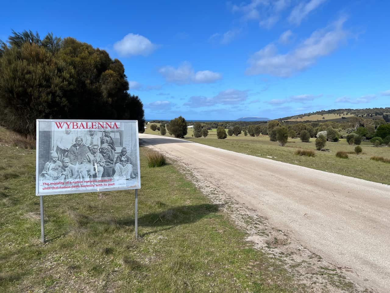 A sign reading Wybalenna next to a country road