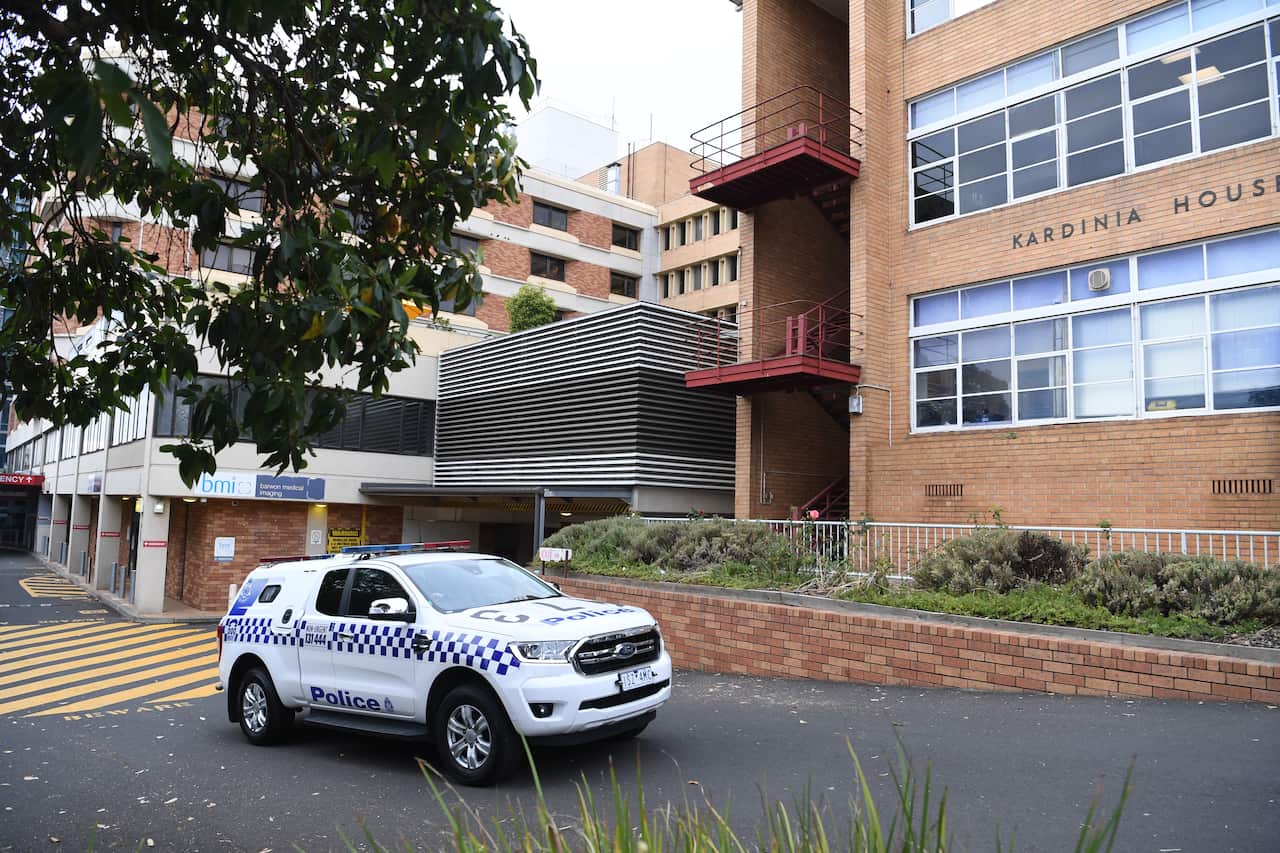 Police car parked outside hospital