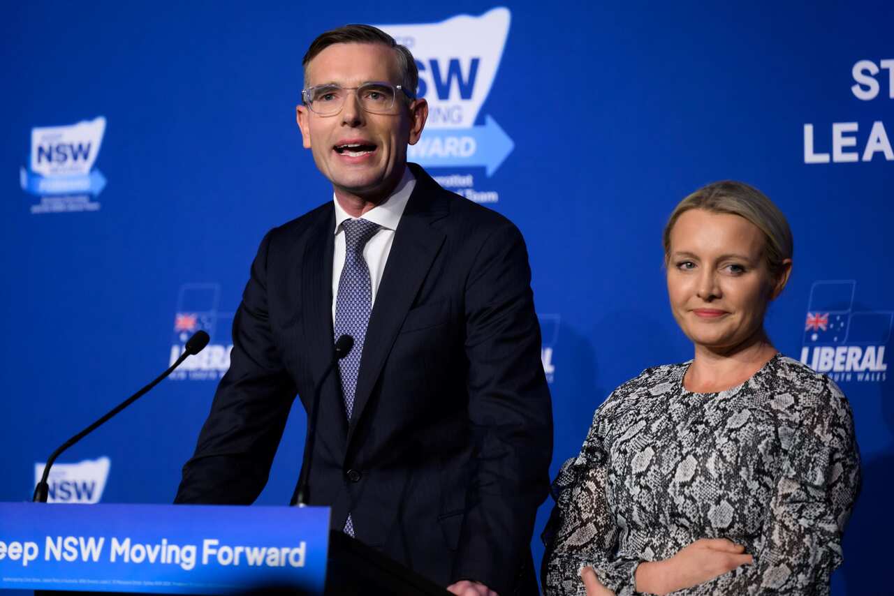 NSW Premier Dominic Perrottet speaking alongside his wife Helen Perrottet at a NSW Liberal Election Night Event