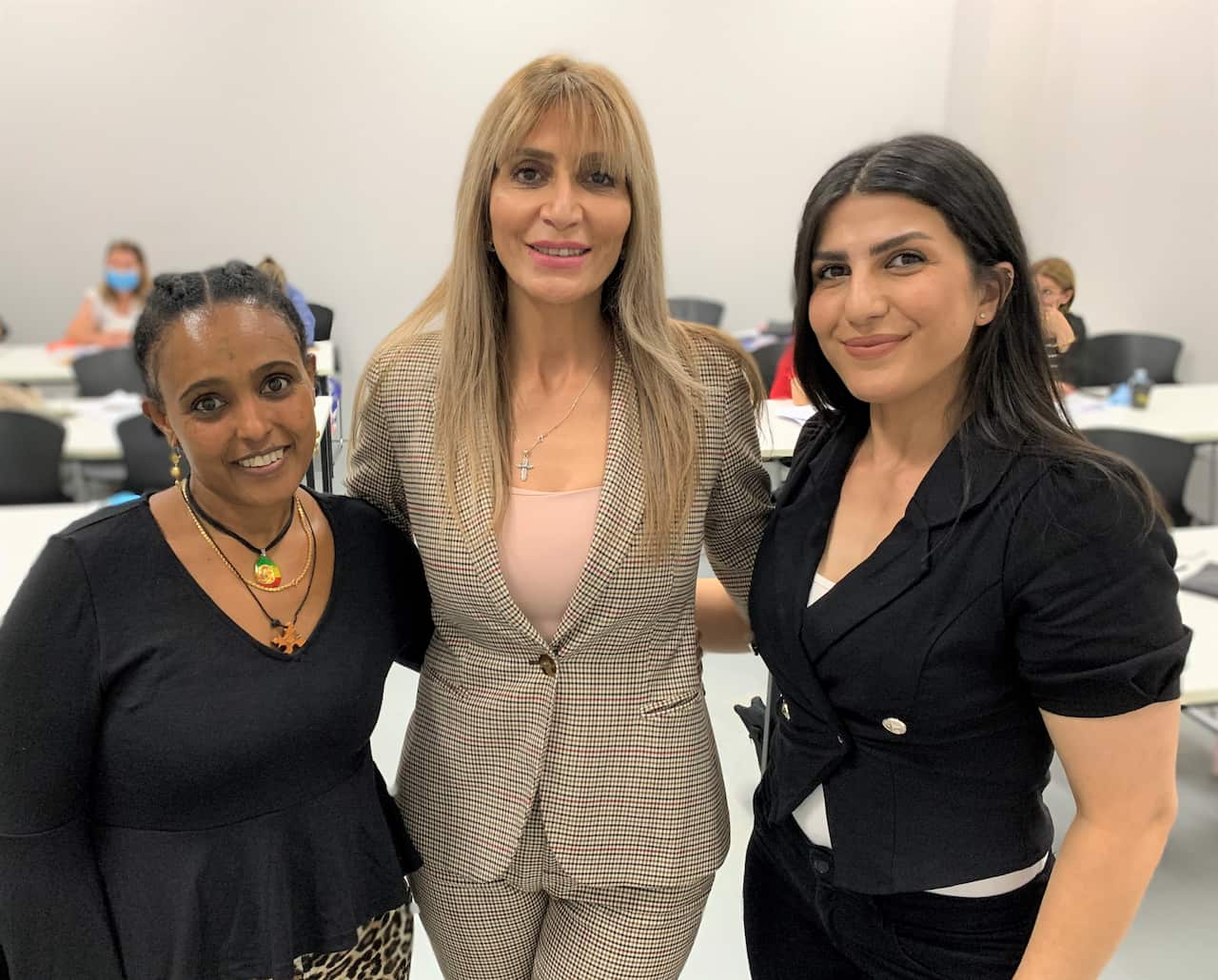 Bushra Francis with two of her students