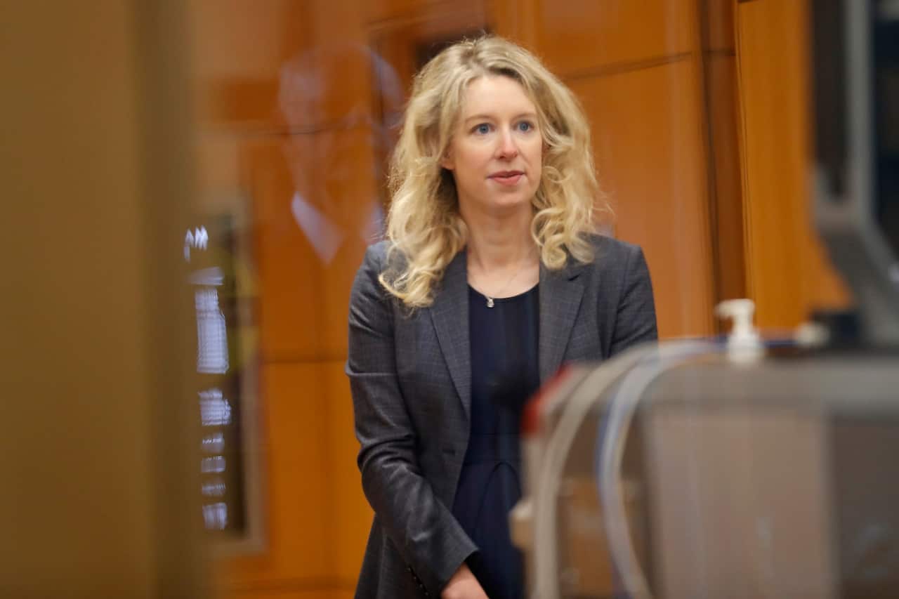Elizabeth Holmes, founder of Theranos, goes through security at the Robert F. Peckham Federal Building and US Courthouse in San Jose.