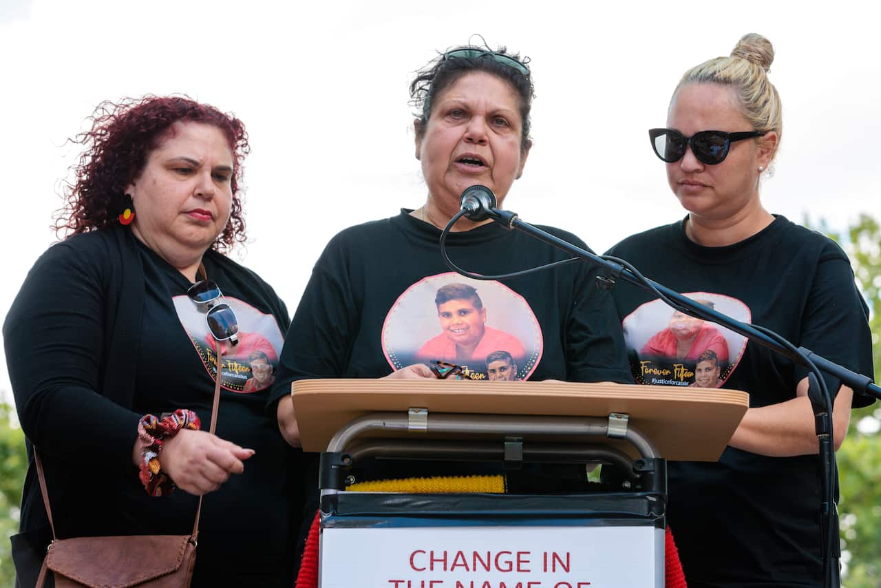 Mechelle Turvey (centre) mother of Cassius Turvey speaks during a rally