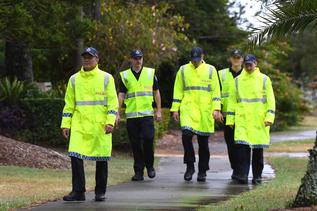 Police walking down a street.