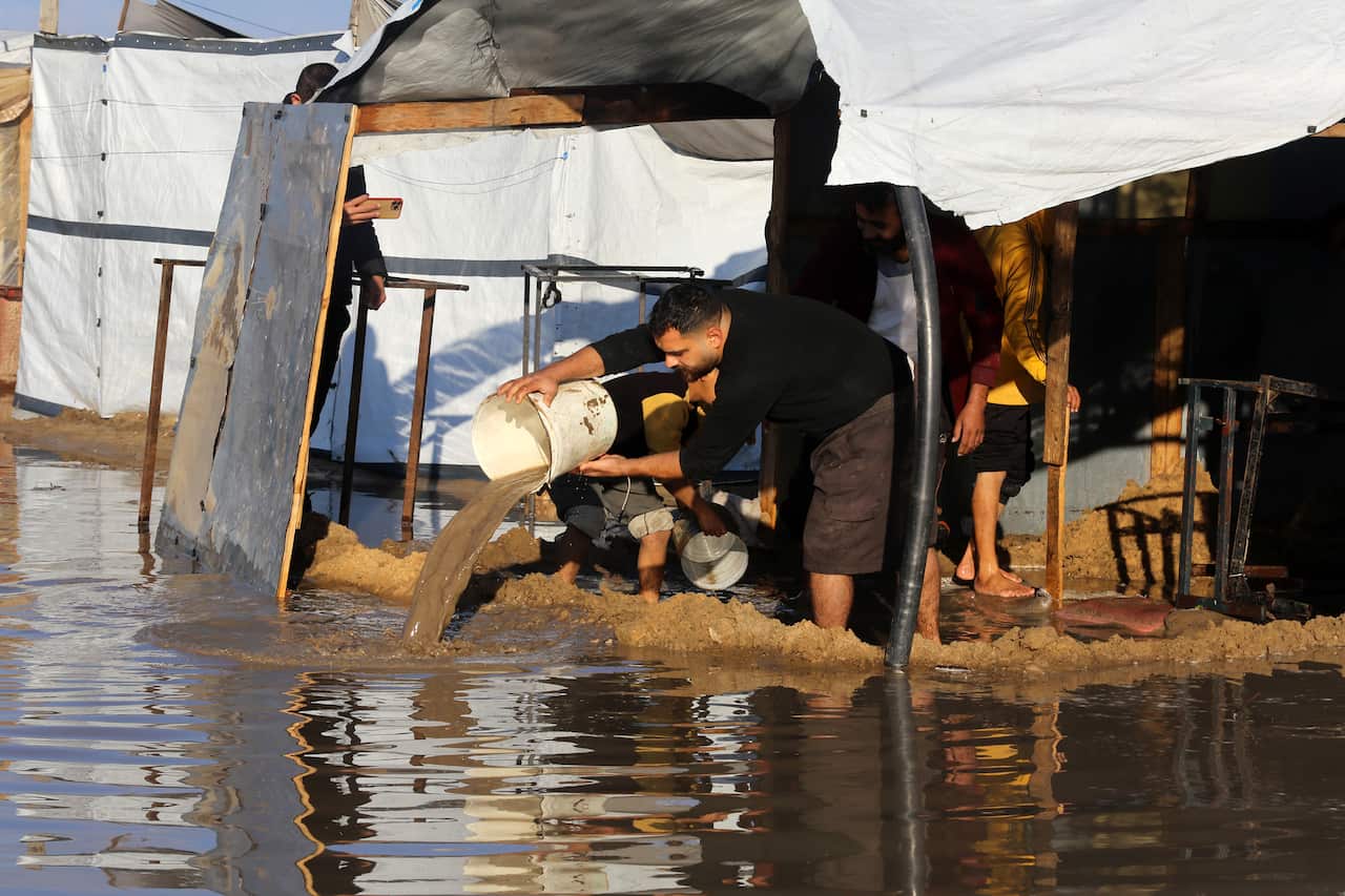 Palestinians in Khan Yunis struggle with harsh weather in makeshift tents amid ongoing Israeli attacks