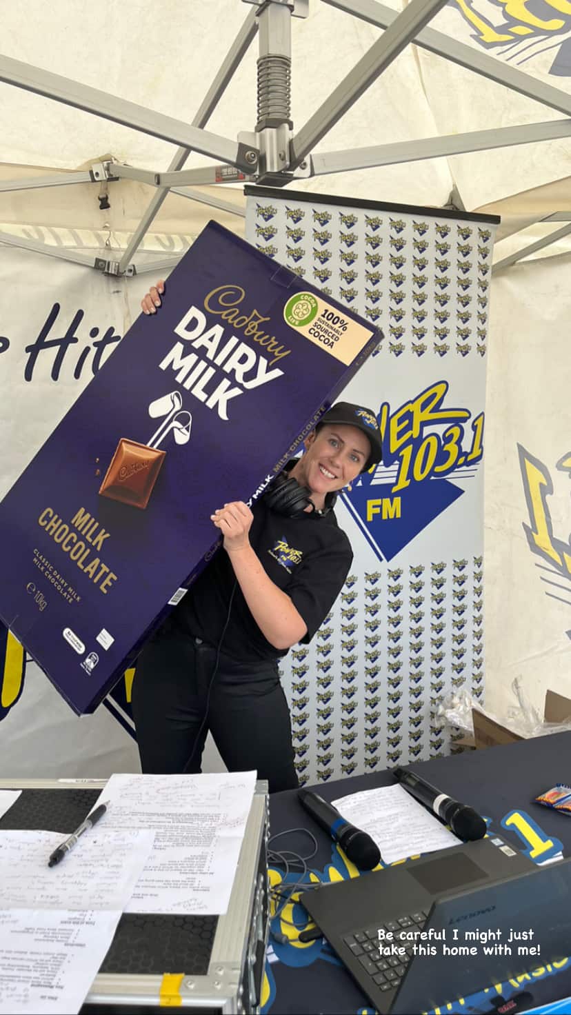 A woman holding a large block of chocolate